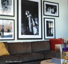Black & white photographs above sectional sofa