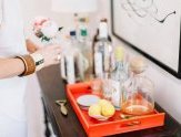 Gen tends bar in chic white. While the rest of Tennessee might like whiskey, the Sohrs start evenings with prosecco topped with St. Germain, to make it “sweeter and fresher.”