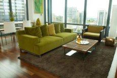 Use an area rug to define and anchor the furniture arrangement in a small living room.
