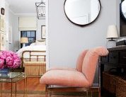 Cole originally wanted light pink walls. Fearing it might read nursery, Alex painted the room with Benjamin Moore Gray Owl and found a pair of Milo Baughman chairs in a blush hue that picks up on the pink tones in the rug.